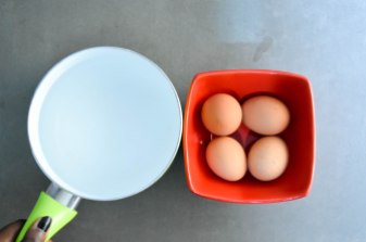 Pot of water, eggs in a bowl