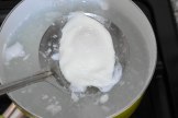 Poached egg out of the boiling water
